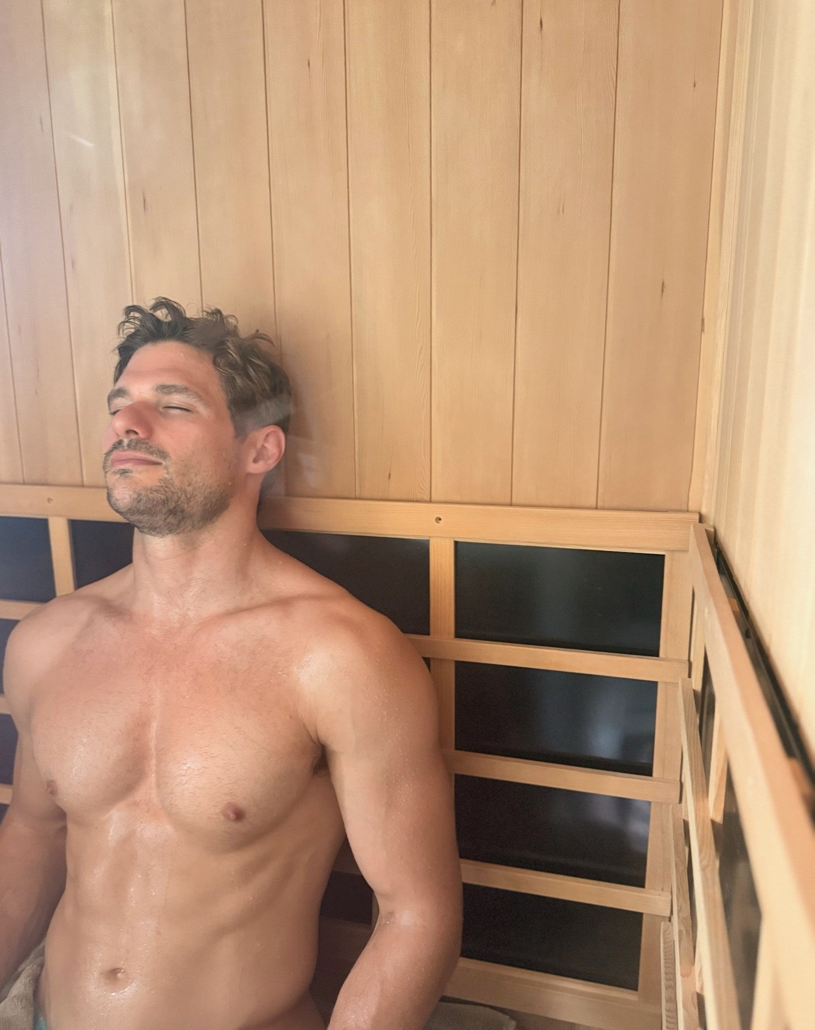 Keeper Health co-founder Angus Macintosh using a sauna