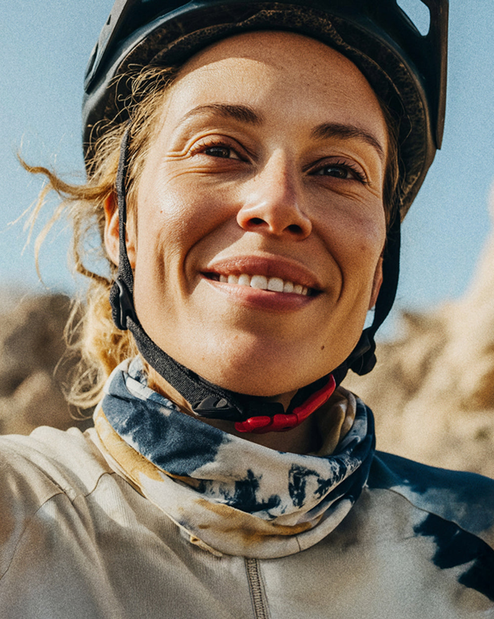 Woman mountain biking wearing helmet